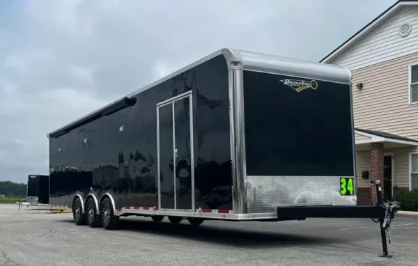 enclosed-car-trailer-2025-34ft-platinum-w-large-corner-bathroom-electric-2.webp
