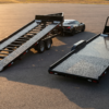 Side-by-side comparison of beavertail open car hauler and hydraulic tilt deck open car hauler — beavertail vs tilt for low cars at PrimeLoad